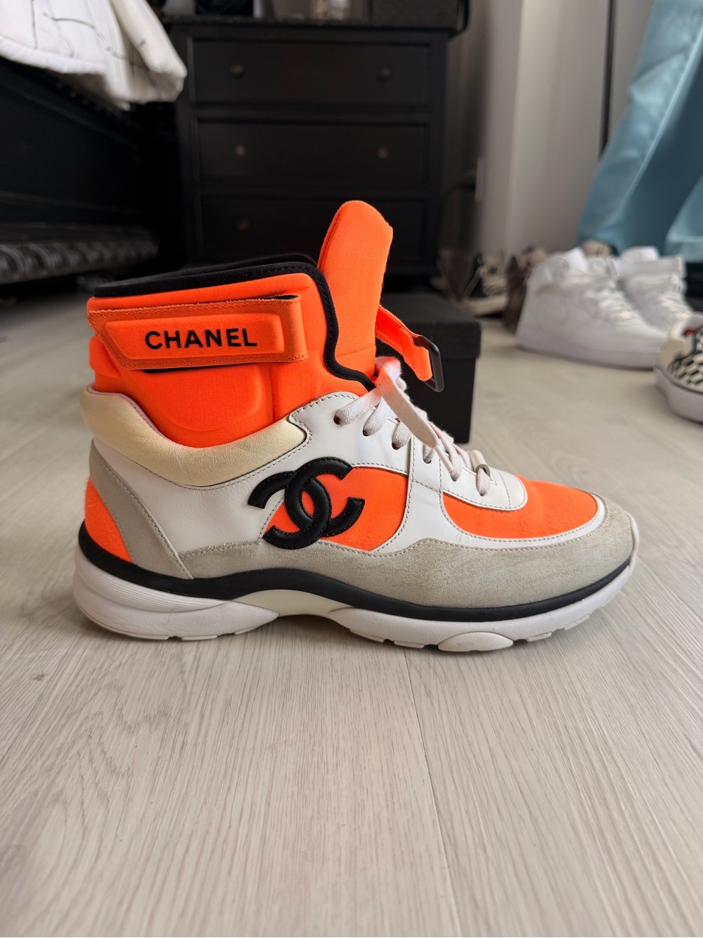 CHANEL Orange and Black High-Top Sneaker